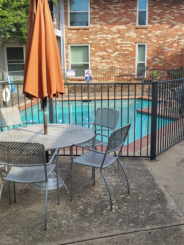 view of swimming pool featuring a patio