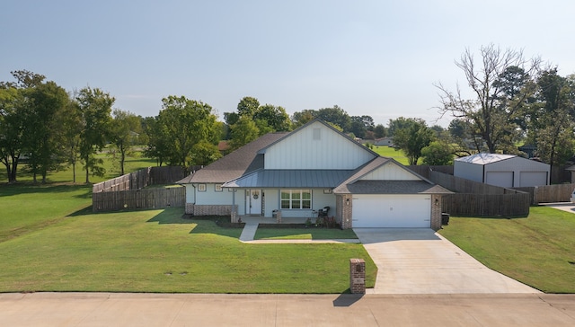 view of front of property with a front yard and a garage