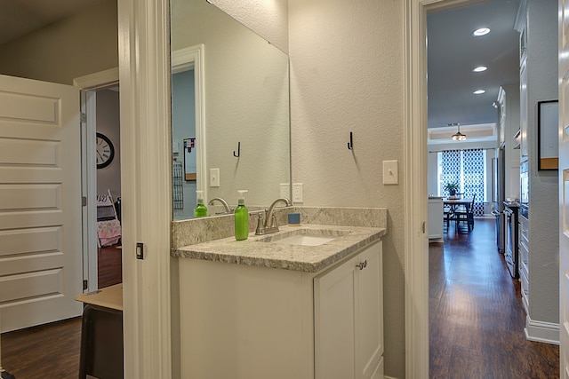 bathroom with wood-type flooring and vanity