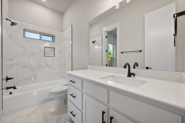 full bathroom with tiled shower / bath, plenty of natural light, vanity, and toilet