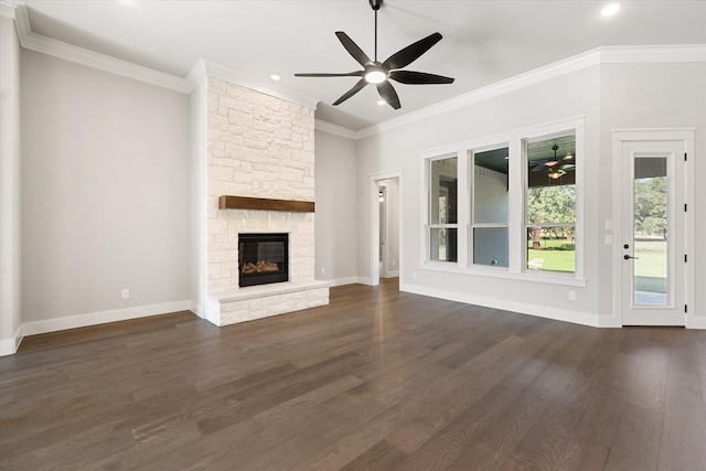 unfurnished living room featuring a fireplace, ornamental molding, dark hardwood / wood-style flooring, and ceiling fan