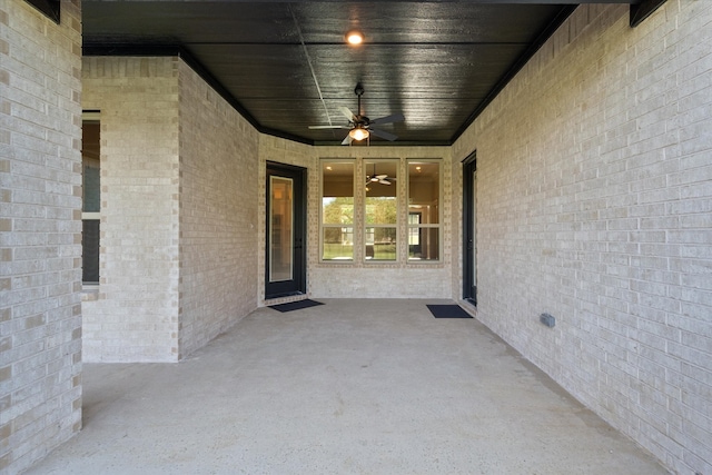 property entrance featuring a patio and ceiling fan