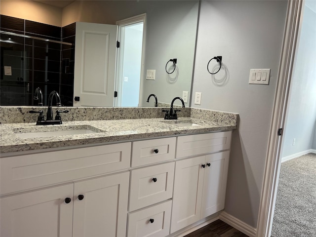 102 Levi Dr, Cleburne, TX 76031 - full bath with double vanity, a shower stall, and baseboards