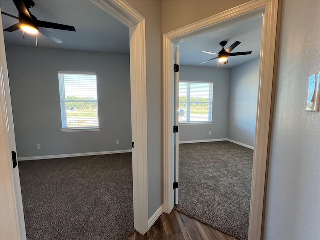 102 Levi Dr, Cleburne, TX 76031 - unfurnished room with a ceiling fan, dark carpet, and baseboards