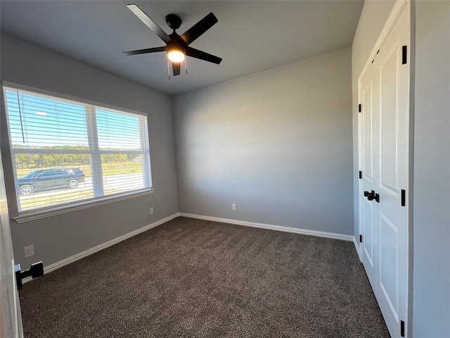 102 Levi Dr, Cleburne, TX 76031 - unfurnished room with dark colored carpet, baseboards, and ceiling fan