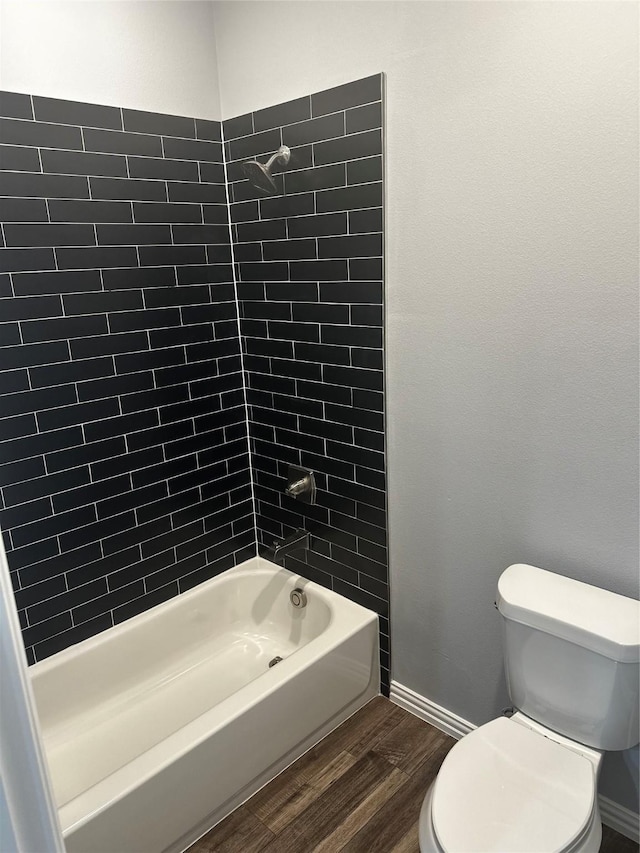 102 Levi Dr, Cleburne, TX 76031 - full bathroom with wood finished floors, toilet, shower / tub combination, and baseboards