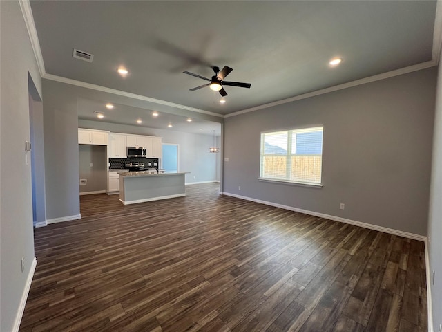 102 Levi Dr, Cleburne, TX 76031 - unfurnished living room with ornamental molding, a ceiling fan, dark wood-type flooring, baseboards, and recessed lighting
