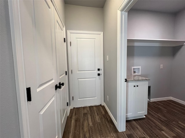 102 Levi Dr, Cleburne, TX 76031 - laundry area with dark wood finished floors, baseboards, and washer hookup
