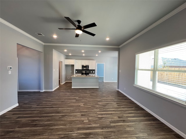 unfurnished living room featuring ceiling fan, dark hardwood / wood-style flooring, and ornamental molding