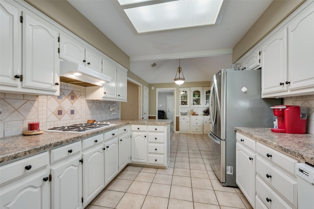 kitchen featuring white cabinets, pendant lighting, white appliances, and kitchen peninsula