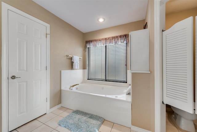 bathroom featuring tile patterned flooring and a washtub