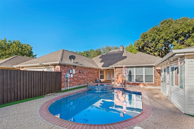 view of pool with an in ground hot tub and a patio area