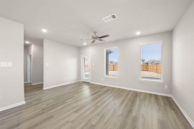 spare room with light hardwood / wood-style flooring and ceiling fan