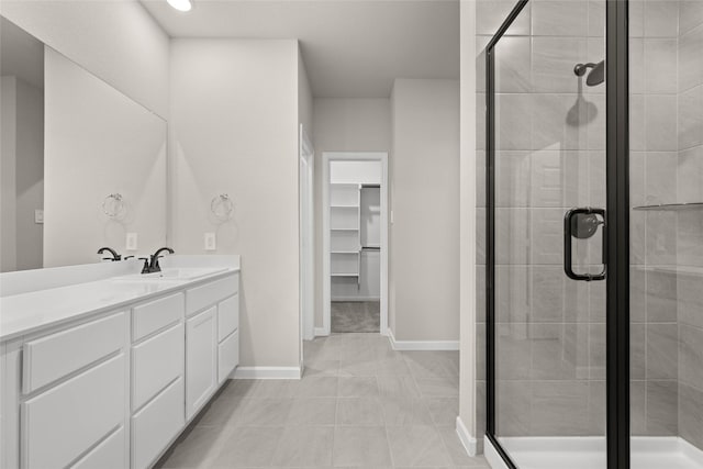 bathroom featuring vanity and an enclosed shower