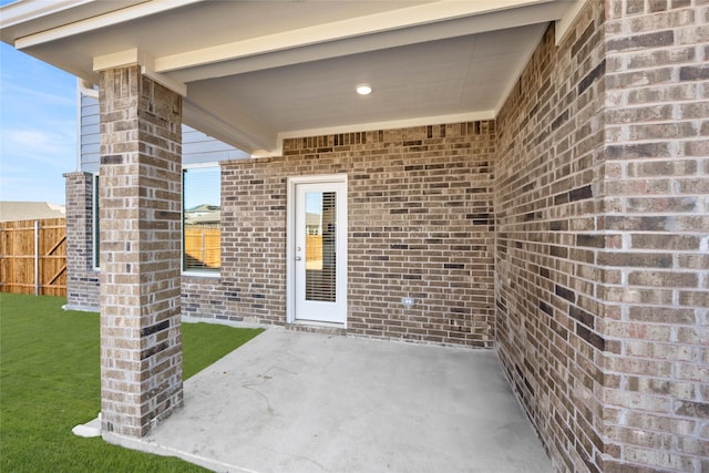 property entrance featuring a patio