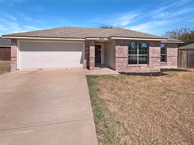 view of front facade with a front yard and a garage