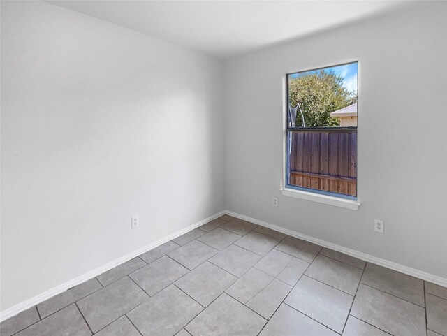 empty room featuring light tile patterned flooring