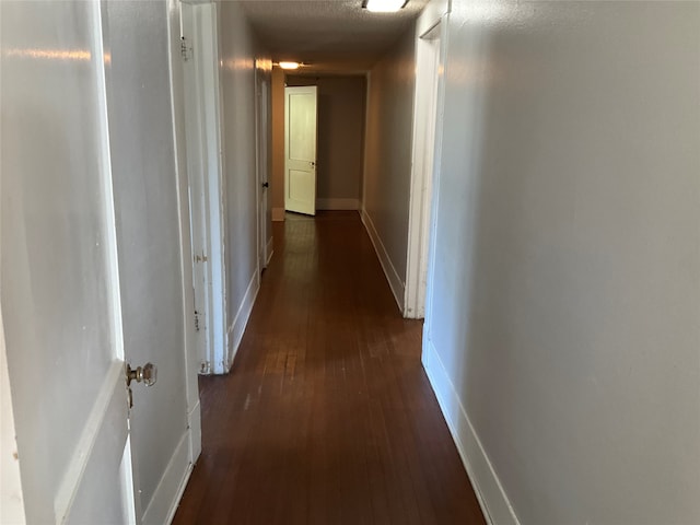 hall featuring dark wood-type flooring