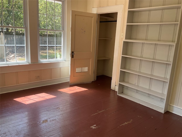 unfurnished bedroom featuring dark hardwood / wood-style floors