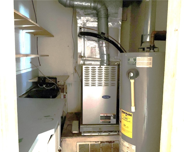 utility room featuring water heater