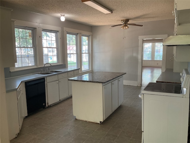 kitchen with dishwasher, white cabinets, a kitchen island, white range oven, and ceiling fan