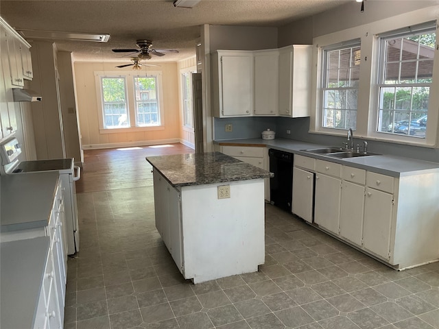 kitchen with white cabinets, sink, a center island, white range oven, and black dishwasher