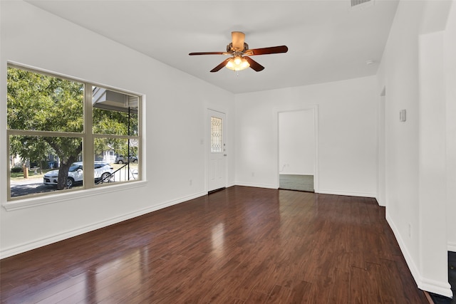 spare room featuring ceiling fan and dark hardwood / wood-style floors