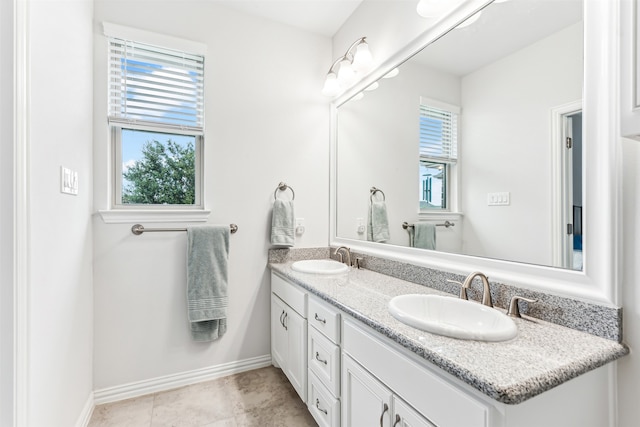 bathroom with tile patterned floors and vanity