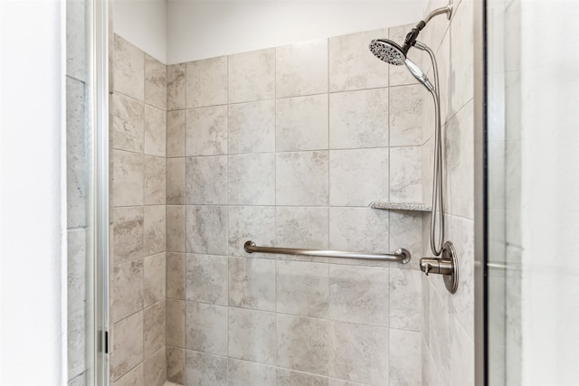 bathroom featuring a shower with door