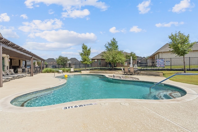 view of swimming pool with a lawn and a patio area