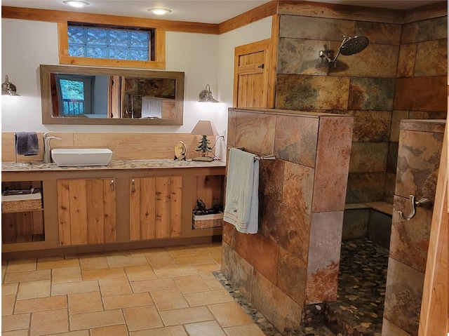 bathroom with walk in shower and vanity