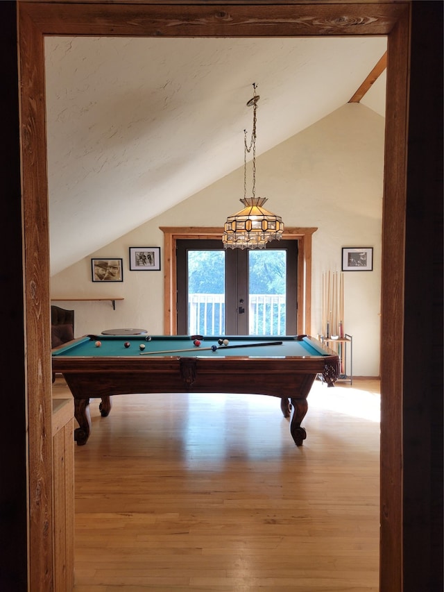 playroom with lofted ceiling, light wood-type flooring, and pool table