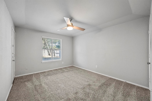 empty room featuring carpet flooring and ceiling fan