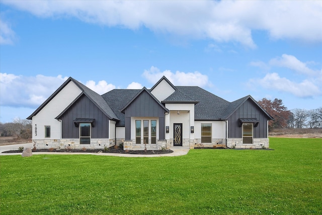 modern inspired farmhouse featuring a front lawn