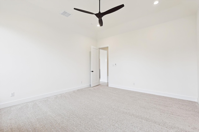 empty room with ceiling fan and light colored carpet