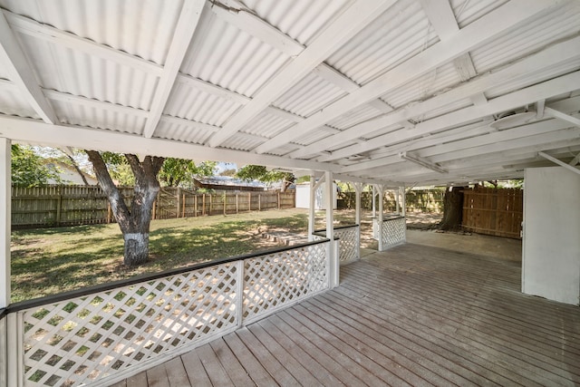 wooden deck featuring a lawn