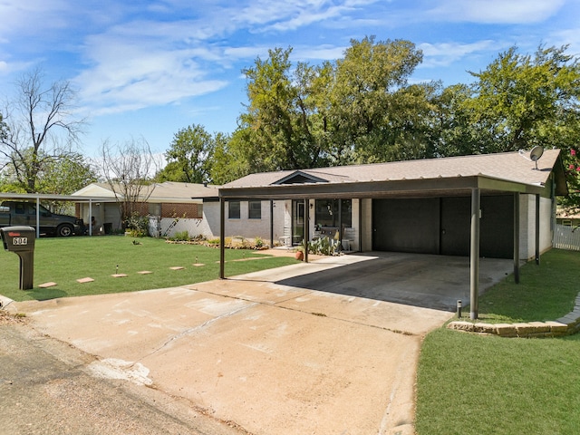 ranch-style house featuring a front yard and a carport