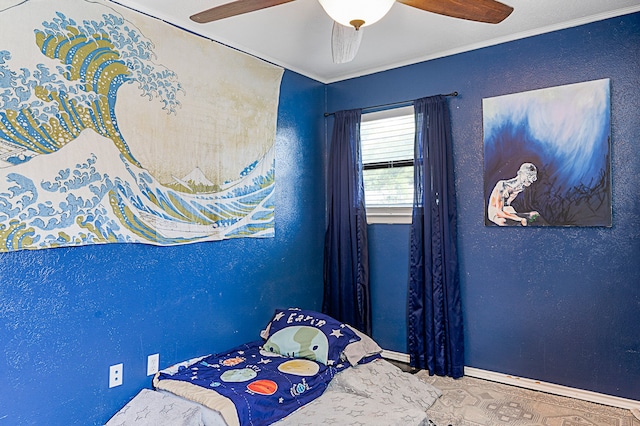 bedroom featuring ornamental molding and ceiling fan