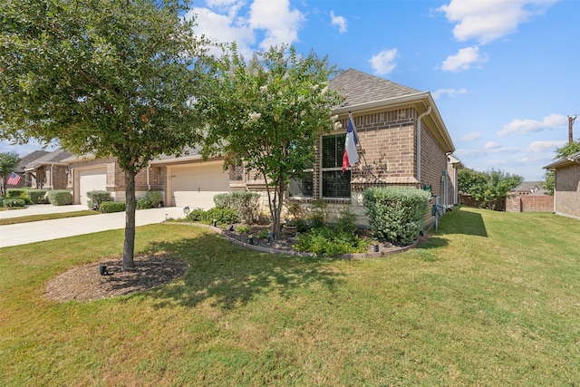 obstructed view of property featuring a garage and a front yard