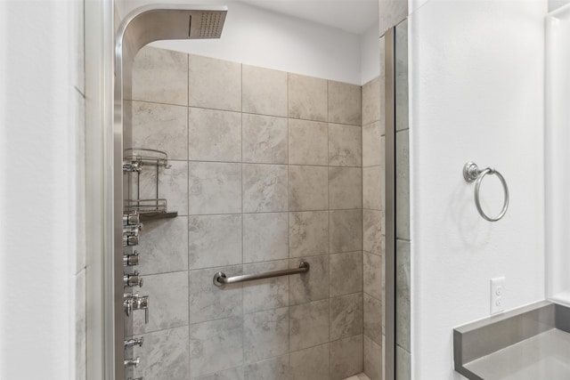 bathroom with a shower with shower door