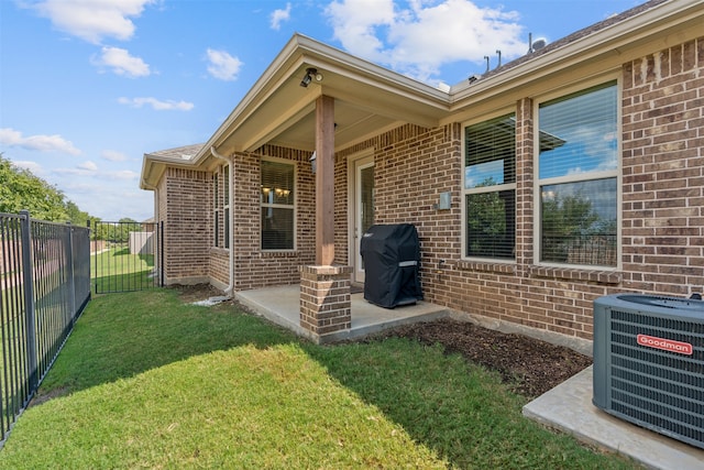 exterior space with a patio, central AC unit, and a yard