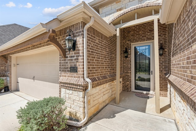 doorway to property featuring a garage