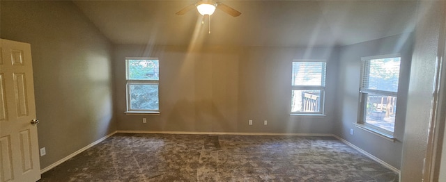 carpeted spare room with lofted ceiling and ceiling fan