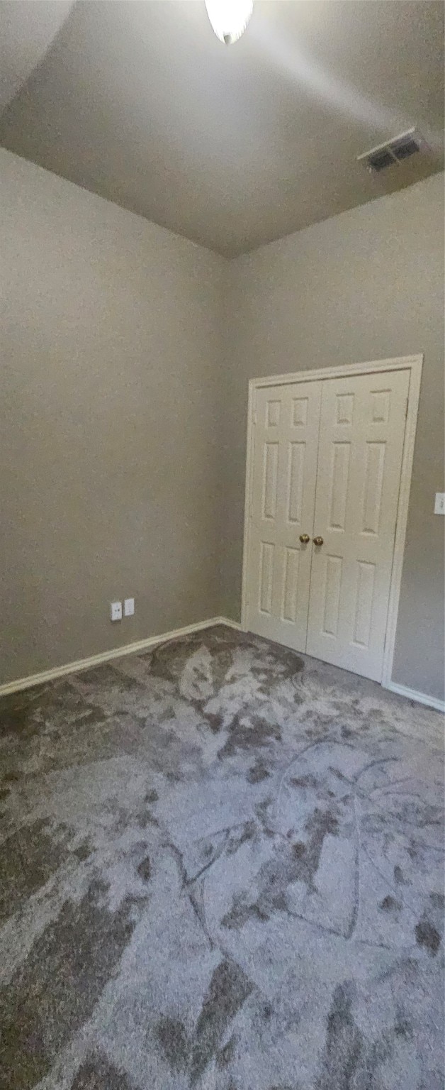 unfurnished bedroom featuring carpet flooring