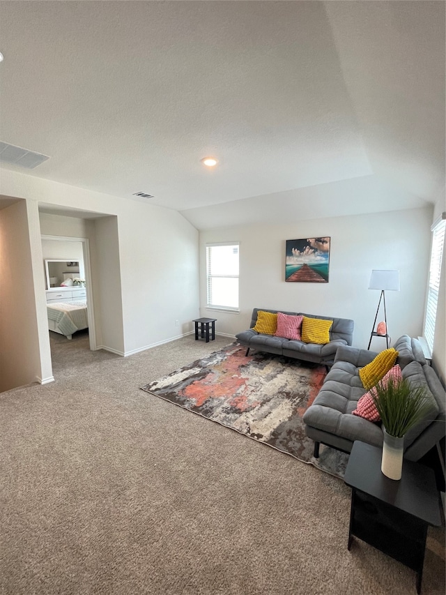 carpeted living room with a textured ceiling