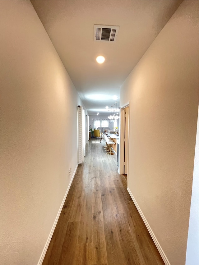 hallway featuring dark hardwood / wood-style flooring