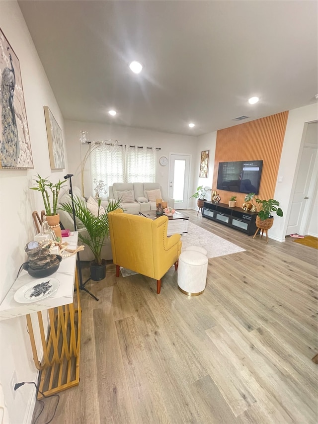 living room with light hardwood / wood-style flooring