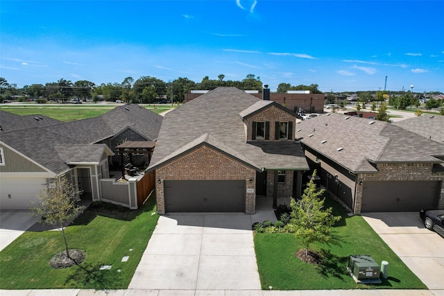 view of front facade with a front yard and a garage