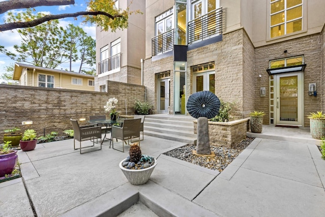 view of patio with a balcony