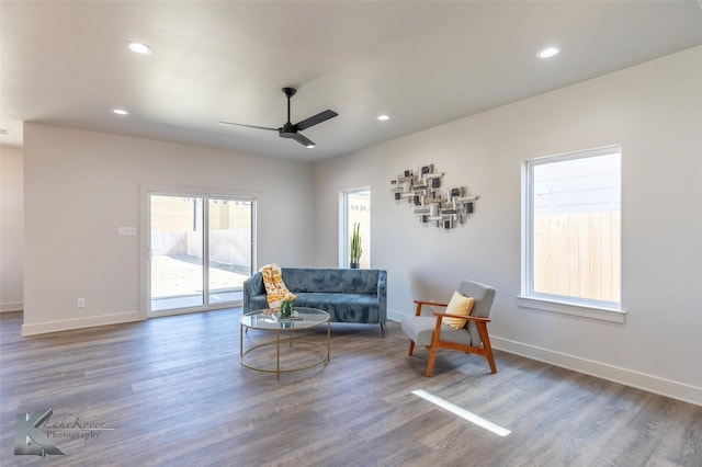 living area featuring ceiling fan, baseboards, wood finished floors, and recessed lighting